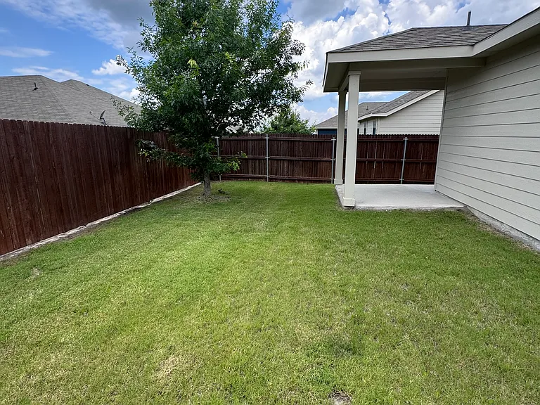 Nice-sized backyard and covered porch.