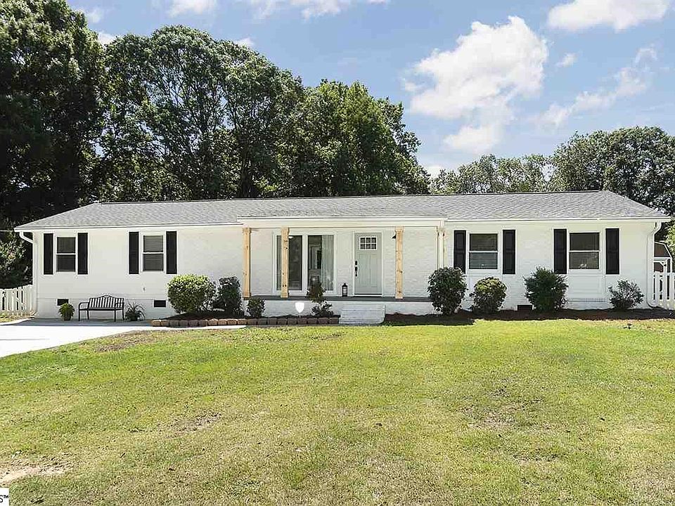 Beautifully painted with a newly paved driveway.