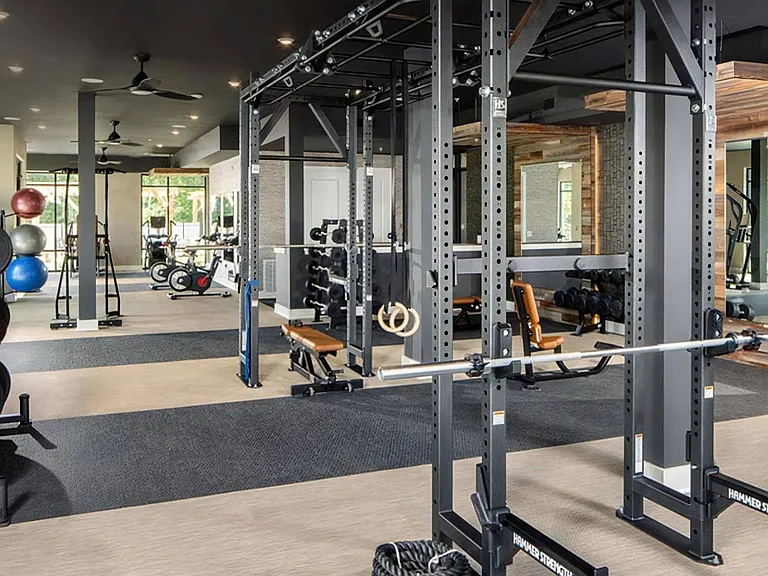 24-Hour Fitness Center with Spin Bikes, Treadmills, and Free Weights