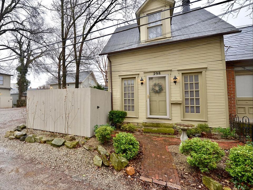 Front of house with enclosed patio to the left.
