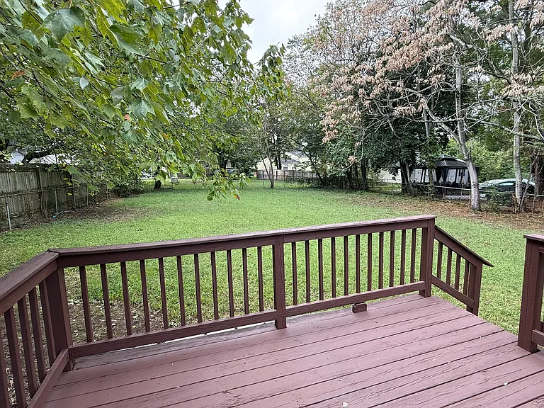Huge, fenced-in backyard and deck.