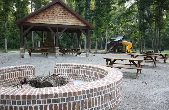 Fire pit and pavilion. Playground no longer exist in background.