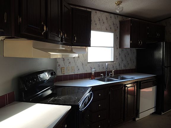 Kitchen comes with flat top range, dishwasher and refrigerat
