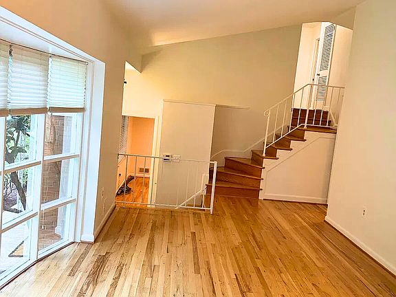 Living Room with smooth flow to Kitchen and Dining Room