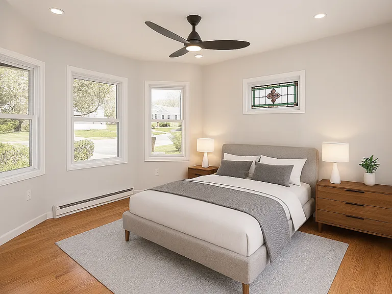 Virtually staged bedroom with bay window.