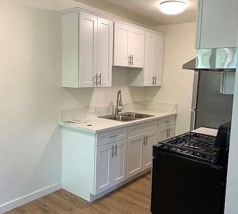 NEW COUNTERTOP AND CABINETS