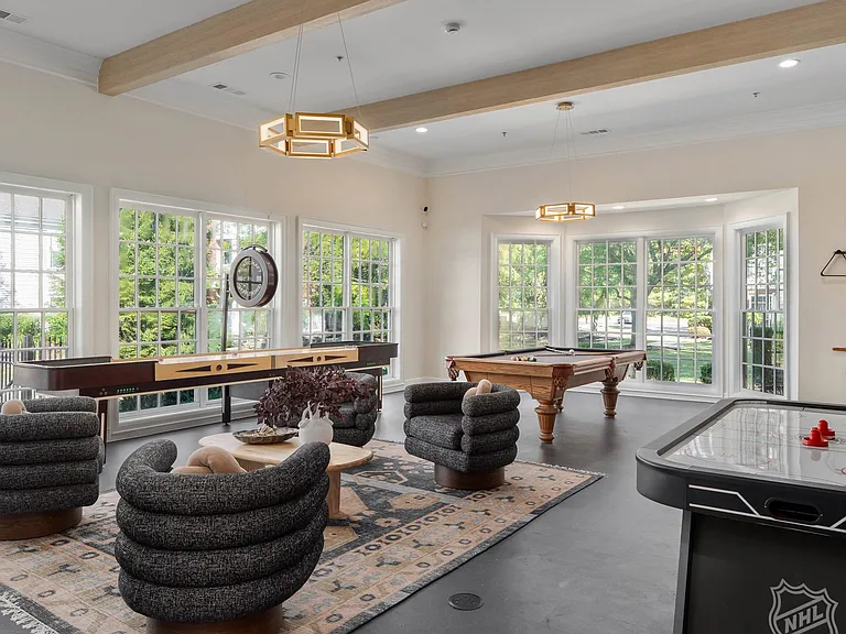 Game Room with air hockey, billiards and shuffleboard tables.