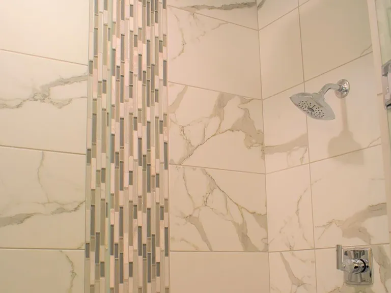 Luxury Tile and Rain Head Shower in Primary Suite