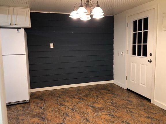 Kitchen w/ back door to deck