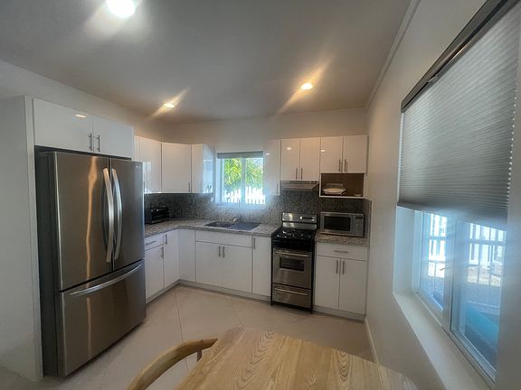 Solid wood cabinetry and newer appliances. Shades on every window.