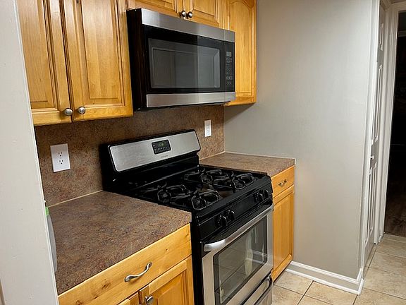 Kitchen - Stove & Microwave side.