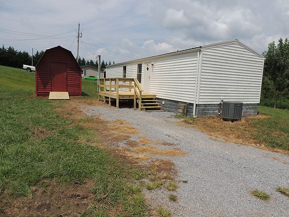 Rear, deck and storage bldg