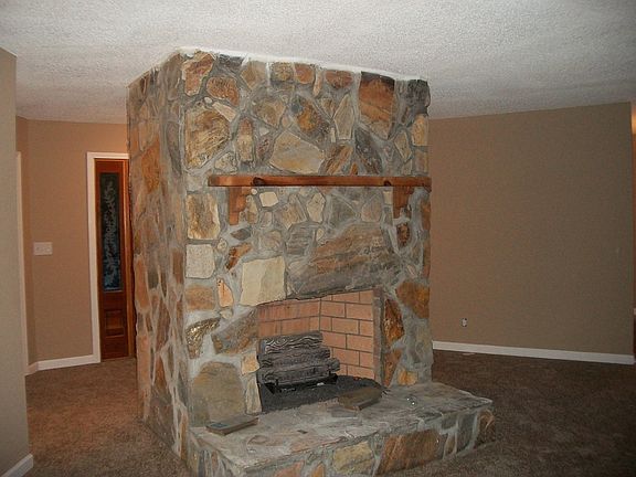 Floor to ceiling Rock Firepl