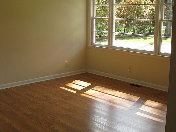 Open and bright living room space. New floors, paint and fixture.