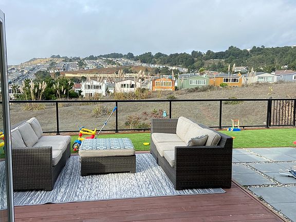 1st Floor folding Glass Doors opens to outside furnished backyard