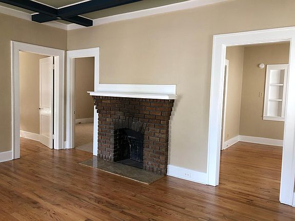 Family room looking into sunroom on the left, then bedroom with the dining room on the right