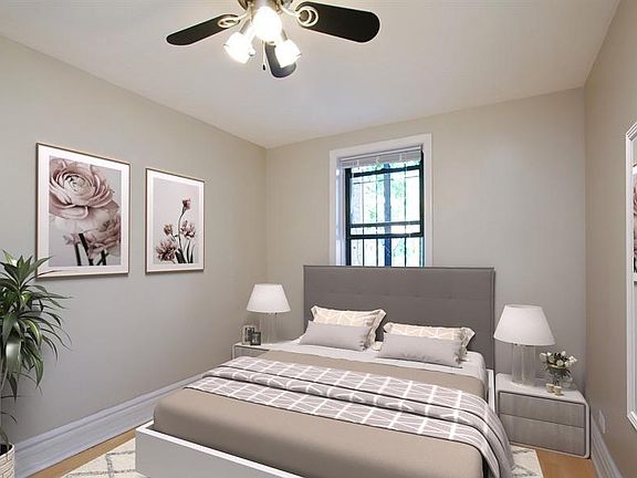Bedroom 1 photo showing furniture, ample space for a queen with nightstands. Large closet not shown in photo. New floors are now in the more modern grey.