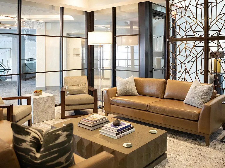 Resident Lounge with Leather Seating and Floor-to-Ceiling Windows