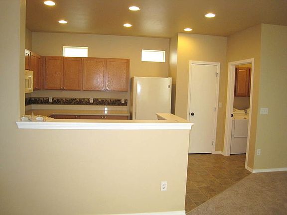 Kitchen is open to the great room with fireplace