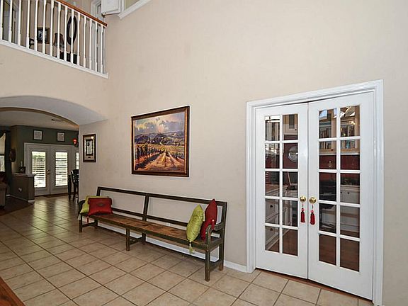 Ten paned French doors open to Study