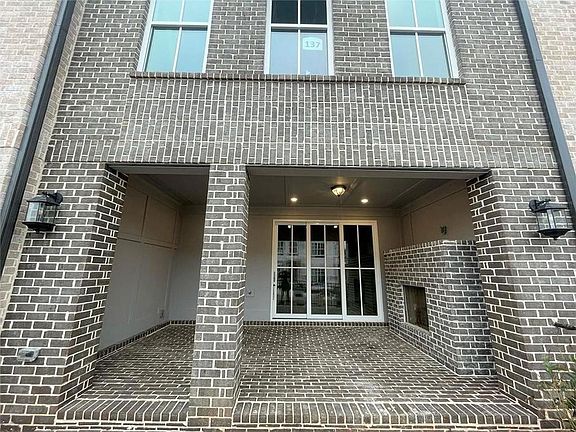 Coveted outdoor patio with fireplace for luxury indoor outdoor living.