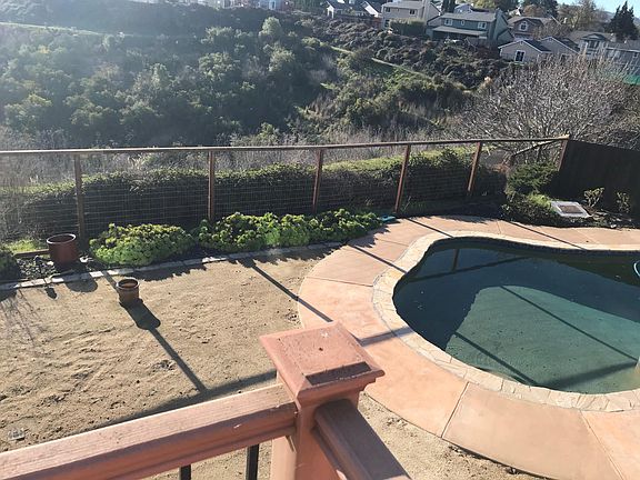 Backyard is low maintenance with decomposed granite and hearty succulents that don't need much water.