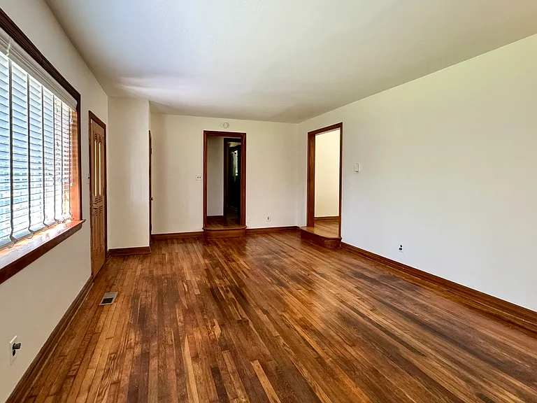 Living room with hardwood flooring.