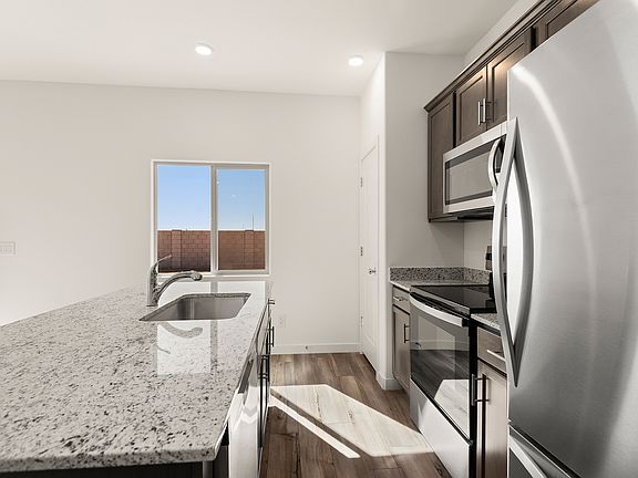 The kitchen comes with upgraded, stainless steel appliances included.