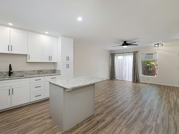 Beautifully remodeled main level features open-concept kitchen, dining and living areas.