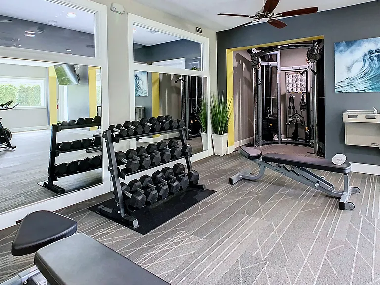 Our resident fitness center boasts an array of free weights for a complete workout.