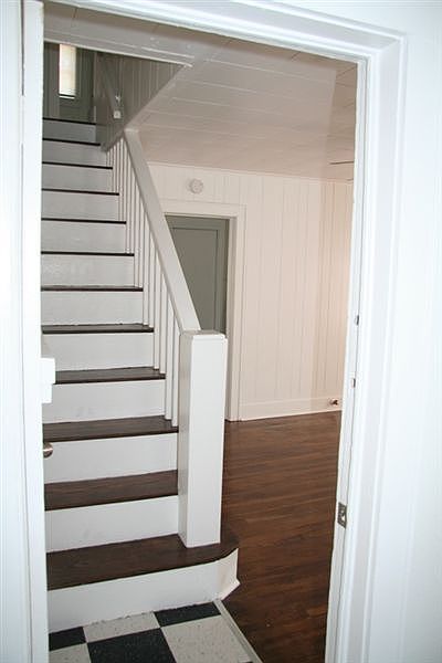 front entrance to living rm & stairs to bedrms & bathrm