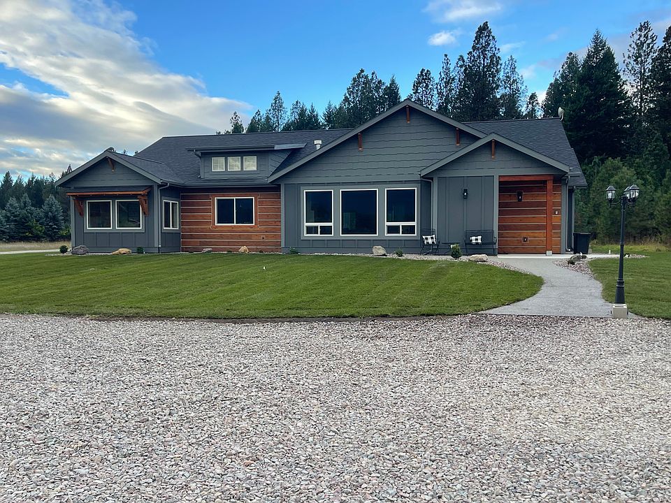 FRONT, with GAZEBO, HOT TUB, GARAGE IN BACK.