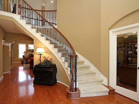 This photo of the Entry shows the sweeping staircase and the entrance to the Study