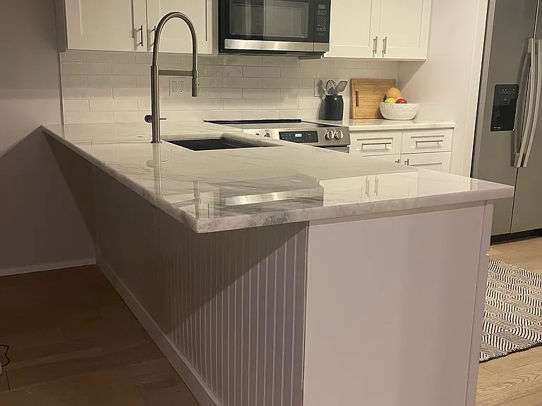 New kitchen - white shaker cabinets, marble counter tops, subway backsplash, stainless steal appliances