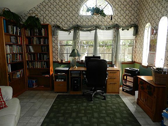 Study is spacious and relaxing with a great view of the landscaped backyard.
