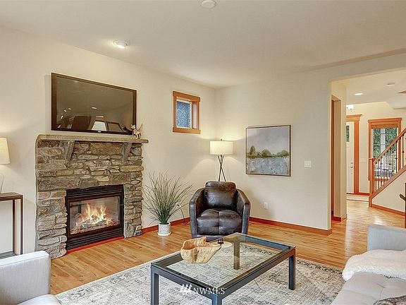 Stone surround gas fireplace.