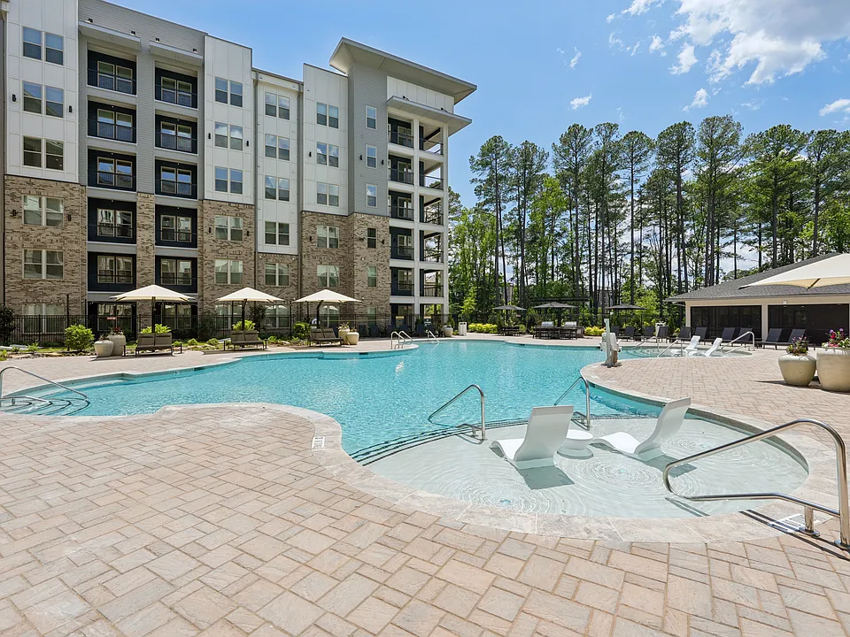 Salt-Water Pool - Resort-style pool with sun shelf, cabanas and grills for relaxing and entertaining close to home.