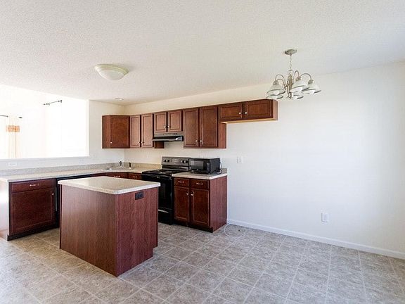 Kitchen with island and eating area