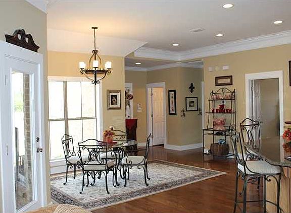 HUGE breakfast area with lots of natural lighting. Door leads out to covered porch.