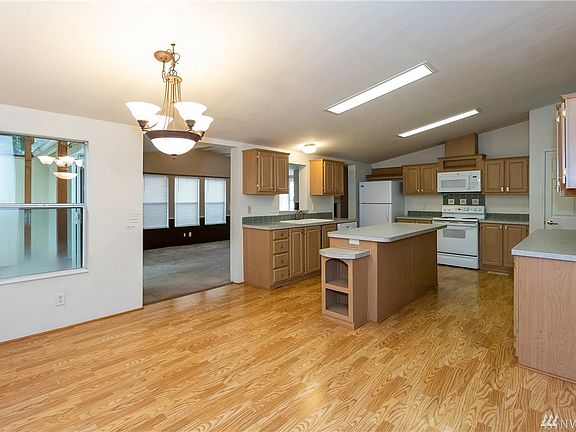 Large eat in kitchen with loads of cabinet space.  Large pantry closet and brand new microwave
