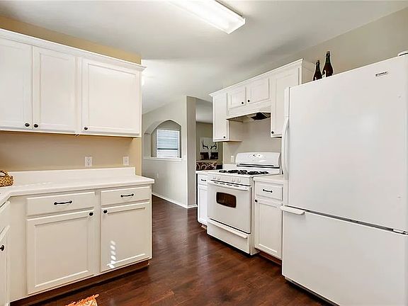 Counters have been upgraded to quartz, LG stainless steal side-by-side fridge
