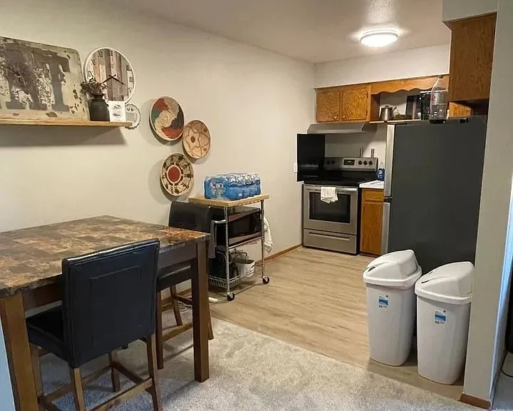 Elevate your living experience at LS Capital Group with modern kitchen amenities and a cozy dining space. Perfect for culinary enthusiasts and everyday meals alike, this inviting layout is designed for comfort. Schedule your tour today!