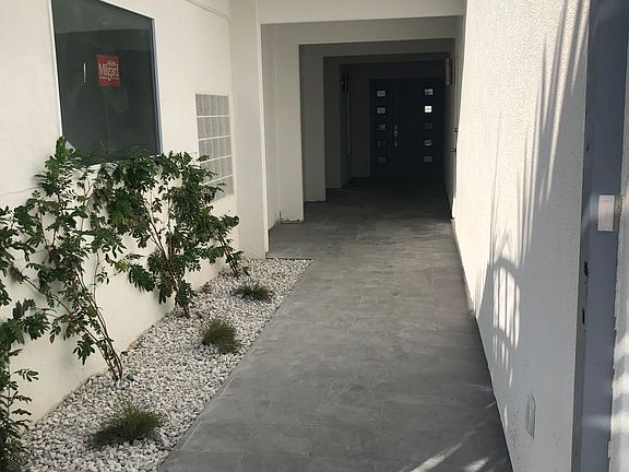 Gated entry with intercom. 