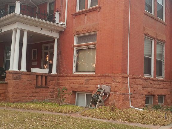 Front of house - unit is on second floor, double windows facing front and side belong to this unit.