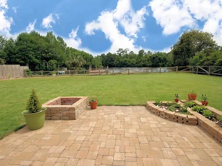 Spacious backyard with lakefront views perfect for families.