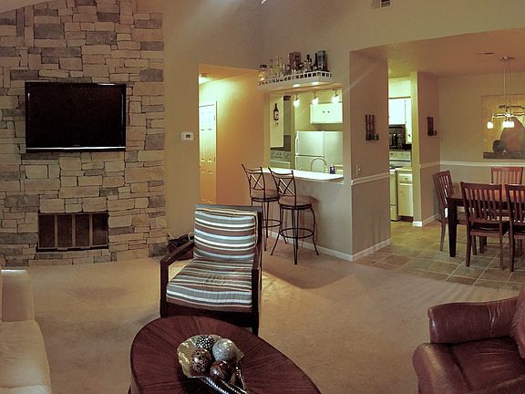 Open area concept with kitchen, den, and dining area