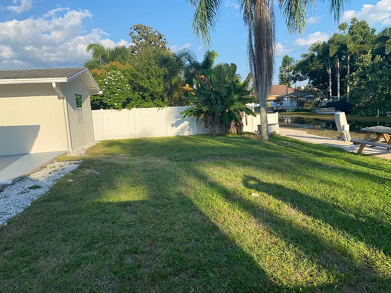 large yard open to canal