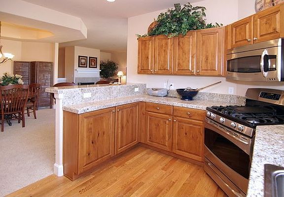 Kitchen with granite tile countertops