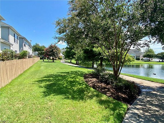 Green space behind back patio offers nice sidewalks
