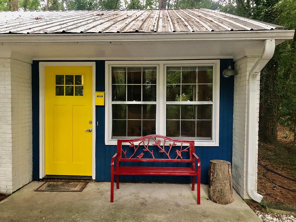 Side B - Bright front door and cheerful bird theme red bench greet you home!